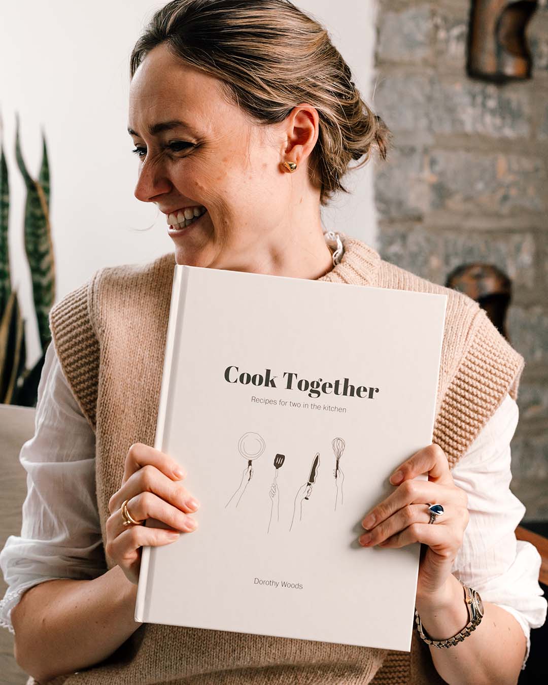 Two people cooking naturally with the Cook Together cookbook
